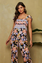 Load image into Gallery viewer, FLORAL BORDER SMOCKED BODICE RUFFLED JUMPSUIT: S / Black
